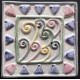 AZULEJO DECORATIVO TACO VIENTO MORADO   10x10cm.